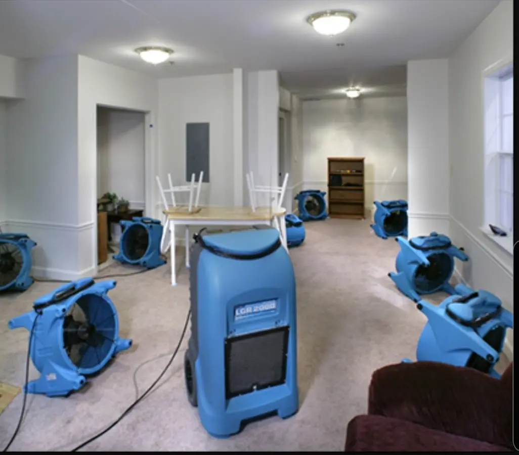 Air movers and dehumidifier setup for Water Damage Restoration in Green